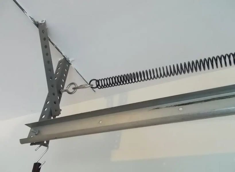 Replacing worn extension springs with safety cables installed